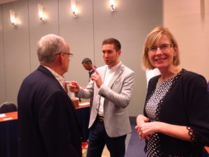Janine Finnell with Jeff Serfass, Director of the Clean Energy Research & Education Foundation (CEREF), speaking with Michael Lemon, Vice President, Biogas Researchers Inc. on the right.